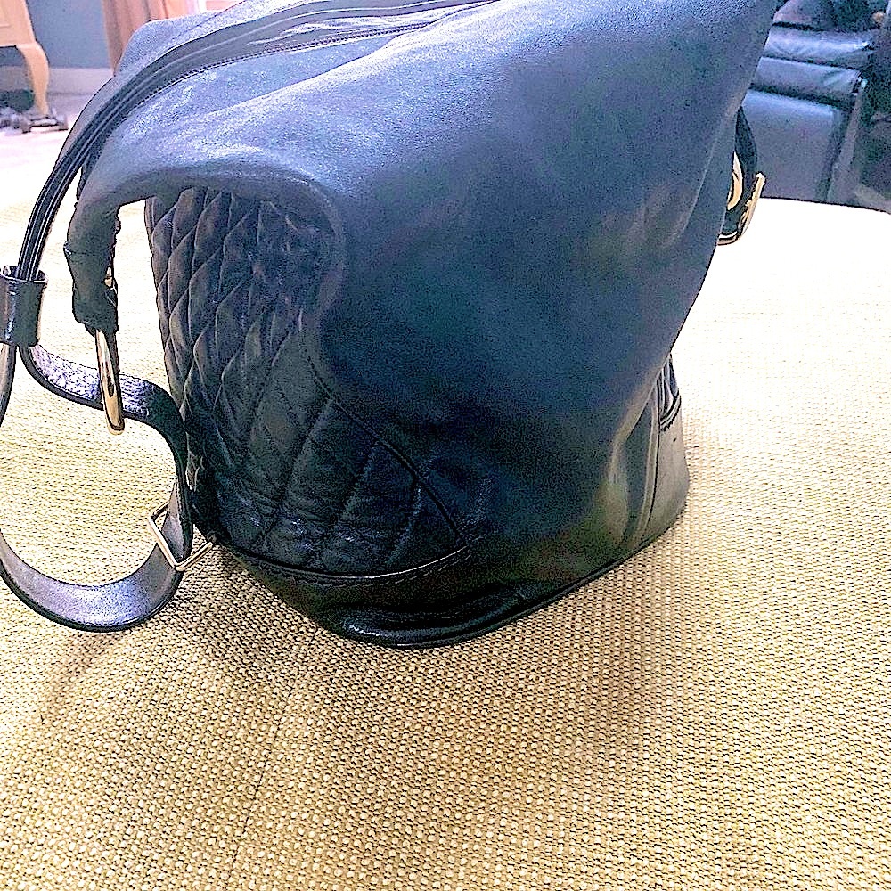 Marino Orlandi black leather bucket sling bag with gold accents